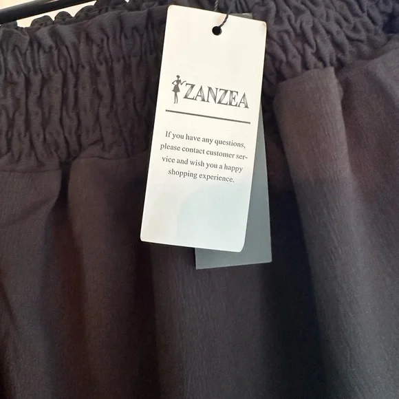 ⭐️NWT Black off the shoulder dress with ruffle sleeves and hem - Picture 8 of 8